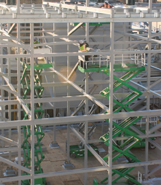 CCS open tower structure being erected using scissor lifts
